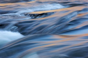 Blue and gold abstract view of water over rocks in a river #20091106-97 Blue and gold abstract view of water over rocks in a river #20091106-97