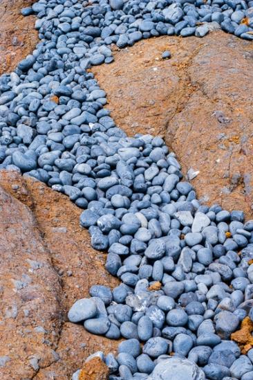 Abstract;Abstraction;Beach;Blue;Boulder;Boulders;Close-up;Cobble Beach;Line;Ocean;Oregon;Pebble;Pebbles;Rock;Rock formations;Rocks;Rocky;Shape;Stone;Stones;beach;beaches;coast;coastline;gray;orange;pattern;red;sea;shore;shoreline;texture