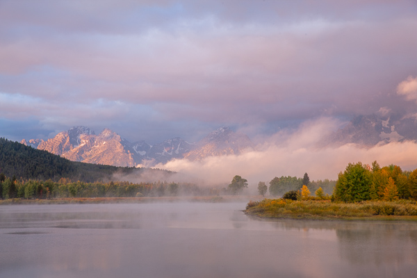 Autumn;Blue;Bluff;Calm;Cloud;Cloud Formation;Clouds;Cloudy;Creek;Fall;Flow;Fog;Forest;Forested;Gold;Grand Teton National Park;Grand Tetons;Grand Tetons National Park;Healing;Health care;Healthcare;Hill;Jackson Hole;Looking up;Mirror;Mist;Mountain;Mountain Side;Mountain Top;Mountainous;Nature;Obscured;Pastoral;Ripple;River;Snake River;Stream;Stream Bank;Summit;Sunlight;Sunshine;Timber;Timberland;Tree;United States;Water;Waterscape;Weather;Wood;Woodland;Woods;Wyoming;Yellow;flowing;foggy;green;haze;hillside;landscape;leaves;mist;misty;oneness;orange;peaceful;plants;reflection;reflections;restful;river bank;serene;sky;soothing;sunlit;tranquil;tree limbs;trees;trunk;zen