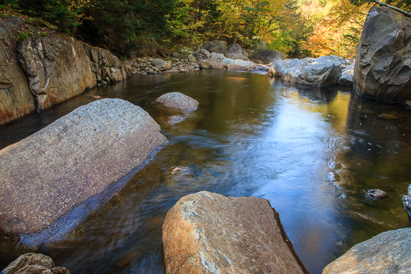Autumn;Big Branch;Blue;Boulder;Branches;Brook;Brown;Calm;Creek;Fall;Geological;Geology;Gold;Healing;Health care;Healthcare;Herbaceous;Nature;River;River Bed;Riverbed;Rivers;Rivulet;Rock;Rock formations;Rocks;Seasons;Stone;Stones;Stream;Streamlet;Tan;Tree;United States;Vermont;Warm Colors;Warm Palette;Warm Tones;Water;Waterscape;Yellow;bark;branch;color;green;landscape;peaceful;plant;reflection;reflections;restful;serene;soothing;striation;tranquil;tree trunk;trees;trunk;waterway