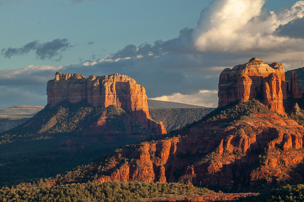 Arizona;Blue;Bluff;Boulder;Boulders;Calm;Canyon;Cloud;Cloud Formation;Clouds;Crag;Dusk;Escarpment;Forest;Geological;Geology;Healing;Health care;Healthcare;Hill;Ledge;Mountain;Mountain Side;Mountain Top;Mountainous;Mountains;Nature;Pastoral;Peak;Pinnacle;Precipice;Range;Rock;Rock Face;Rock formations;Rocks;Rocky;Sedona;Sheer;Steep;Stone;Stones;Striated;Striations;Summit;Tan;Timberland;United States;Wood;Woodland;Woods;Yellow;cliff;close of day;dusk;evening;eventide;green;hillside;landscape;last Light;nightfall;oneness;orange;peaceful;red;restful;serene;sky;soothing;striation;sun;sundown;sunset;tranquil;trees;twilight;zen