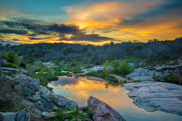Blossom;Blossoms;Blue;Boulder;Boulders;Calm;Cloud;Cloud Formation;Clouds;Concepts;Cool Colors;Cool Palette;Cool Tones;Creek;Flow;Floweret;Flowering;Flowers;Flowers & Plants;Green;Greens;Healing;Health care;Healthcare;Minimalism;Nature;Oneness;Pastoral;Ripple;River;Rock;Rock formations;Rocks;Rocky;Stone;Stream;Stream Bank;Sunset;Texas;Water;Yellow;bloom;color;flora;floral;flower;flowing;green;landscape;peaceful;plants;reflection;reflections;restful;river bank;serene;sky;soothing;tranquil;zen
