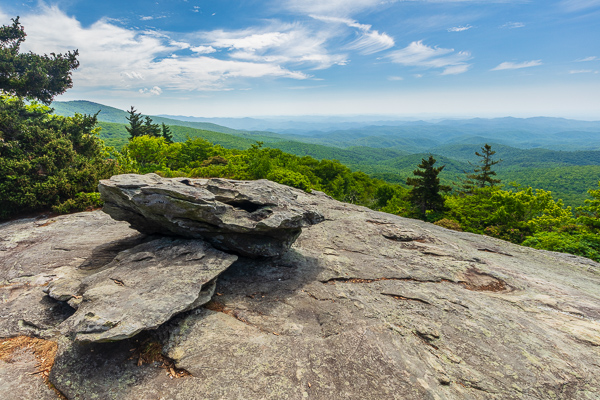 Blue;Blue Ridge Parkway;Bluff;Boulder;Boulders;Branches;Calm;Cloud;Cloud Formation;Clouds;Geological;Geology;Healing;Health care;Healthcare;Hill;Mountain;Mountain Side;Mountain Top;Mountainous;Mountains;Nature;North Carolina;Pastoral;Pinnacle;Precipice;Rock;Rock formations;Rocks;Rocky;Stone;Stones;Summit;Sunlight;Sunshine;Tan;Tree;United States;green;landscape;oneness;peaceful;plants;restful;serene;sky;soothing;sunlit;tranquil;tree limbs;trees;zen