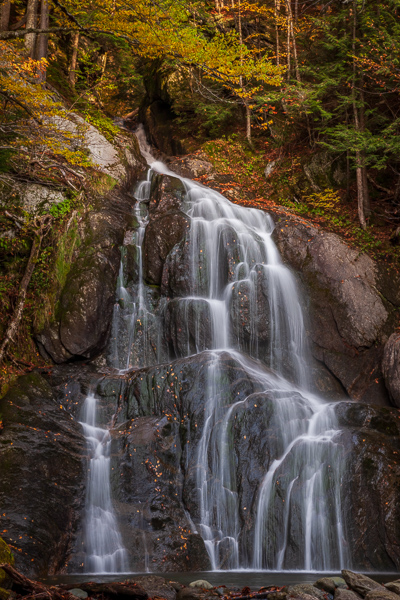 Autumn;Bluff;Boulder;Boulders;Branches;Brown;Calm;Cascade;Cascading;Chute;Cool;Fall;Falling;Falls;Flow;Forest;Forested;Gold;Healing;Health care;Healthcare;Moss Glen Falls;Nature;New England;Pastoral;Pouring;Rock;Rock Face;Rock formations;Rocks;Rocky;Seasons;Spilling;Stone;Stones;Stream;Streaming;Tan;Timber;Timberland;Tree;United States;Vermont;Water;Waterfalls;Waterscape;Woodland;Woods;Yellow;cliff;green;landscape;leaves;limbs;oneness;peaceful;plants;restful;serene;soothing;tranquil;tree limbs;trees;trunk;waterfall;wet;zen