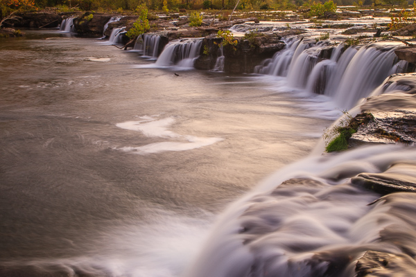 Botanical;Boulder;Boulders;Brown;Calm;Cascade;Cascading;Chute;Creek;Falls;Flow;Geological;Geology;Healing;Health care;Healthcare;Nature;Pastoral;Pouring;River;Rock;Rock formations;Rocks;Rocky;Sandstone Falls;Spilling;Stone;Stones;Stream;Stream Bank;Streaming;Sunlight;Sunshine;Tan;United States;Water;Waterfalls;Waterscape;West Virginia;botanicals;dawn;daybreak;flowing;foliage;green;landscape;morn;morning;oneness;peaceful;rapids;restful;river bank;serene;soothing;sunlit;sunrise;sunup;tranquil;waterfall;wet;zen